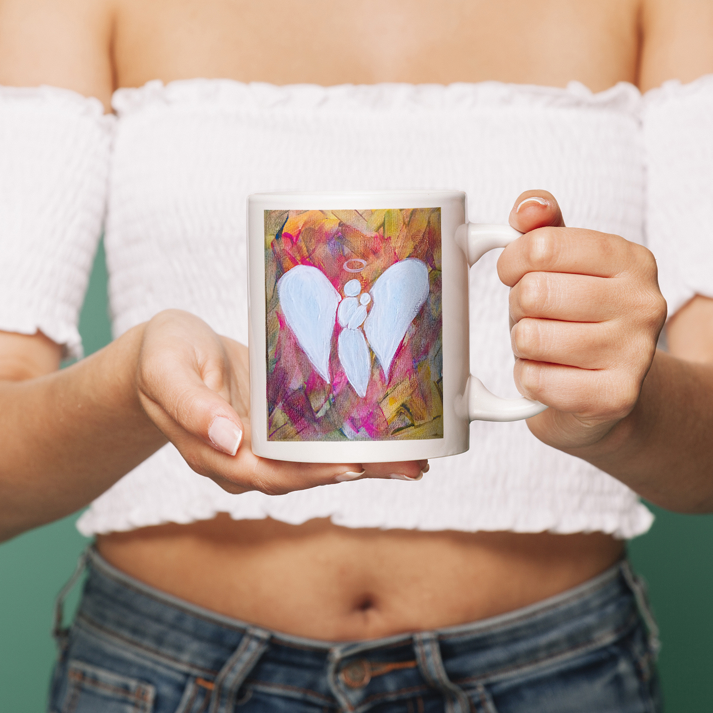Elegant ceramic mug featuring Angel Color artwork by Elena Giaconelli, showcasing intricate angel design on a white background.